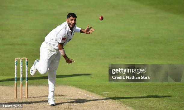 Jeetan Patel of Warwickshire runs into bowl during the Specsavers County Championship Division One match between Warwickshire and Somerset at...