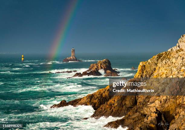 storm in bretagne with huge waves and rainbow - pointe du raz - brest brittany stock pictures, royalty-free photos & images