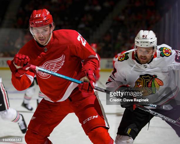 Michael Rasmussen of the Detroit Red Wings battles for position with Jacob Nilsson of the Chicago Blackhawks during a pre-season NHL game at Little...