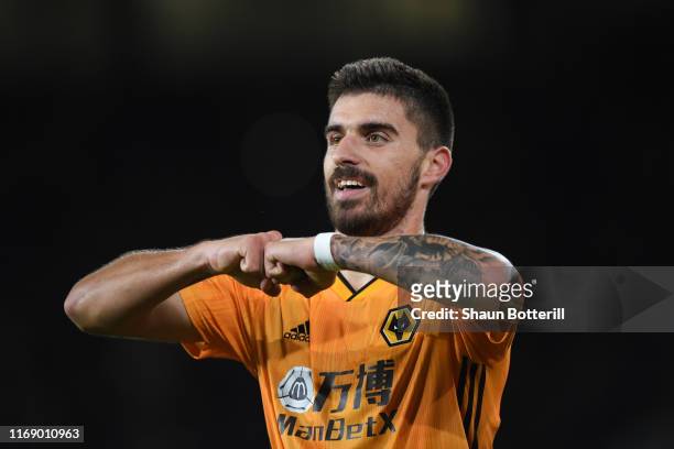 Ruben Neves of Wolverhampton Wanderers celebrates after scoring his team's first goal during the Premier League match between Wolverhampton Wanderers...