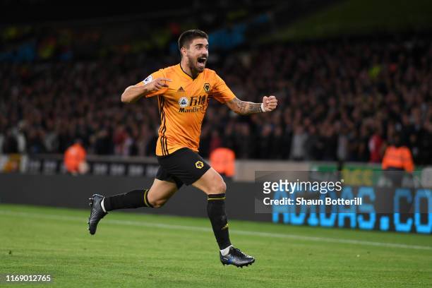 Ruben Neves of Wolverhampton Wanderers celebrates after scoring his team's first goal during the Premier League match between Wolverhampton Wanderers...