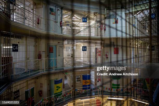 Landscape view across the central hall to the multiple levels of Wing C and E and of Her Majestys Prison Pentonville, London, United Kingdom....