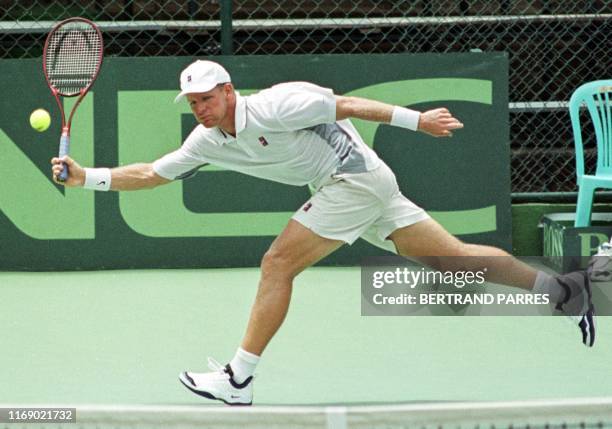 Mark Knowles of the Bahamas, returns the tennis ball to his opponent as he competes for the Davis Cup Bahamas in Caracas, Venezula 26 September 1999....