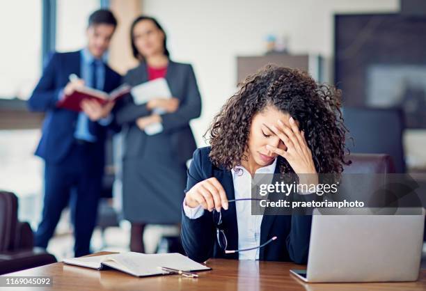 burnout businesswoman under pressure in the office - threats stock pictures, royalty-free photos & images