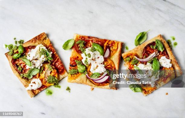 flatbread pizza on white background - pizzeria stock-fotos und bilder