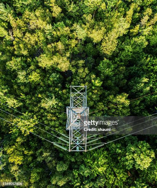 aerial drone view: power pylon - electric cable stock pictures, royalty-free photos & images