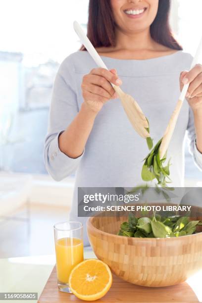 woman making fresh salad - salad server stock pictures, royalty-free photos & images