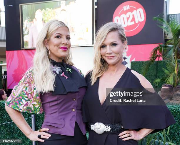 Tori Spelling and Jennie Garth attend the Beverly Hills 90210 Costume Exhibit Event at The Atrium at Westfield Century City on August 19, 2019 in Los...