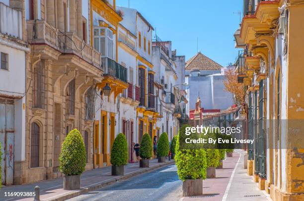 typical andalucian street - jerez de la frontera - jerez de la frontera stock pictures, royalty-free photos & images
