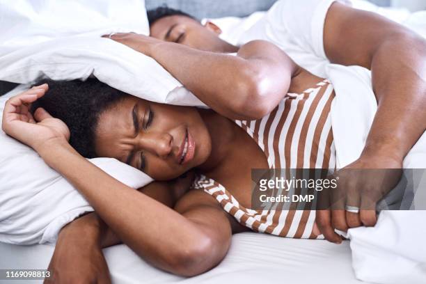 how can i make it stop! - snoring husband stock pictures, royalty-free photos & images