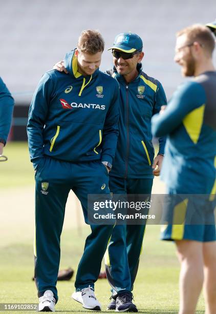 Justin Langer, coach of Australia, speaks to Steve Smith of Australia during the Australia Nets session at Headingley on August 20, 2019 in Leeds,...