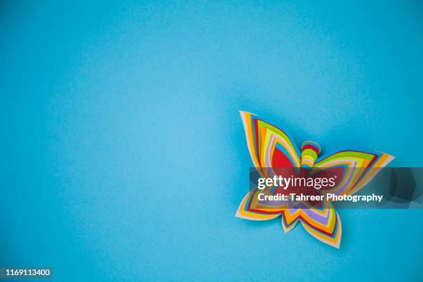 colorful butterfly origami - white flower paper stock-fotos und bilder