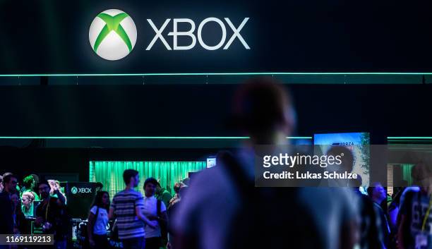 Visitors visit the booth of XBOX during the press day at the 2019 Gamescom gaming trade fair on August 20, 2019 in Cologne, Germany. Gamescom 2019,...