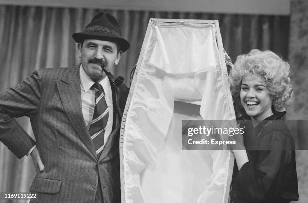 English actor Leonard Rossiter as 'Inspector Truscott' and Irish actress Gemma Craven as 'Nurse Fay' in play 'Loot' at the Ambassador's Theatre,...