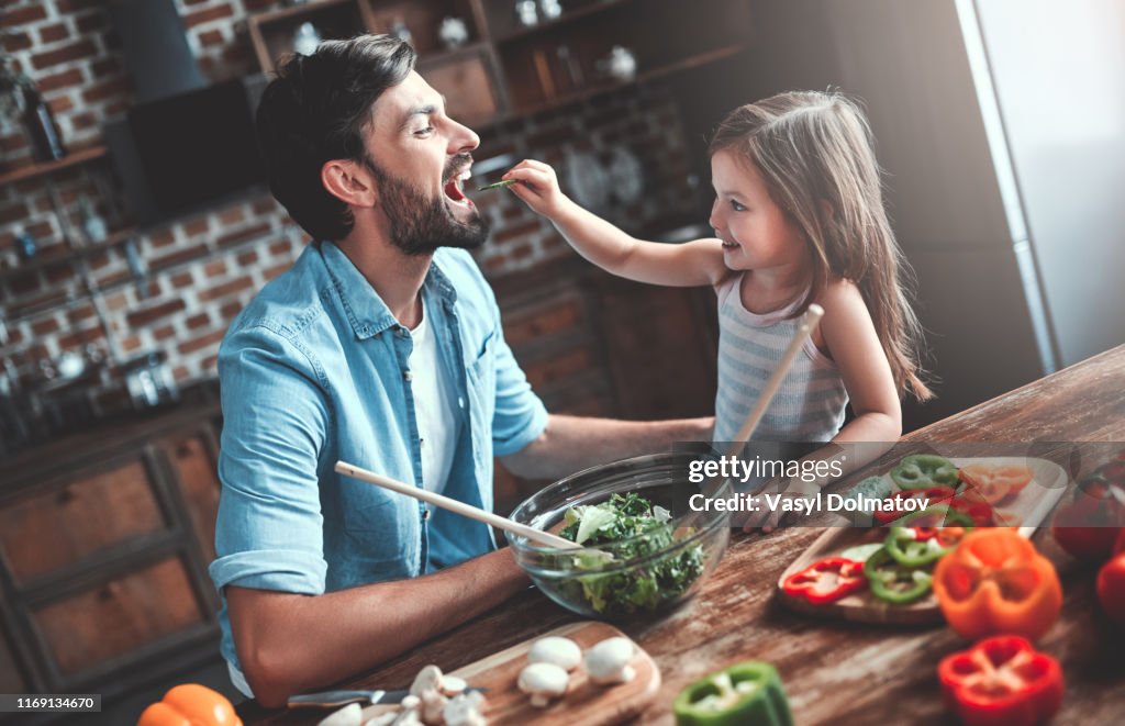 Dad with daughter on kitchen