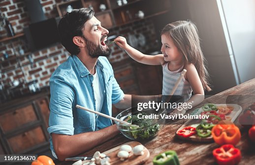 Dad with daughter on kitchen Dad with daughter on kitchen