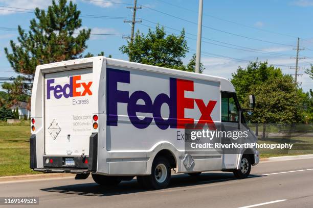 fedex delivery truck - fed ex stock pictures, royalty-free photos & images