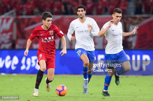 Oscar of Shanghai SIPG drives the ball during the 2019 Chinese Football Association Cup semi-final match between Shanghai SIPG and Shandong Luneng at...