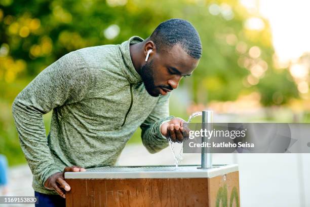 forget your water bottle is not a problem in the park - drinking fountain stock pictures, royalty-free photos & images