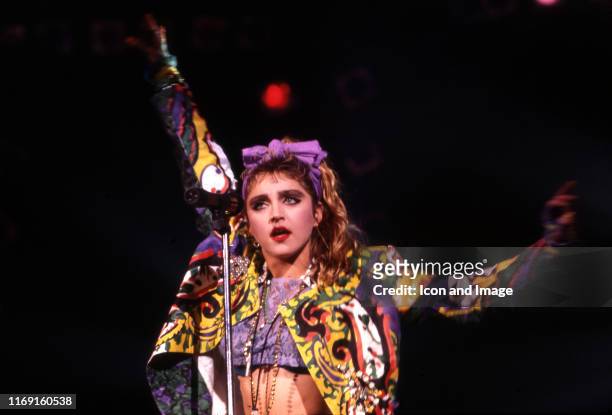 American, singer, songwriter and actress, Madonna, on stage during the "Virgin Tour" on May 25 at Cobo Arena in Detroit, Michigan.