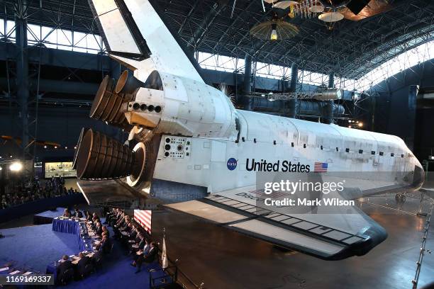 The Space Shuttle Discovery is the back drop as U.S. Vice President Mike Pence chairs the 6th meeting of the National Space Council on "Leading the...