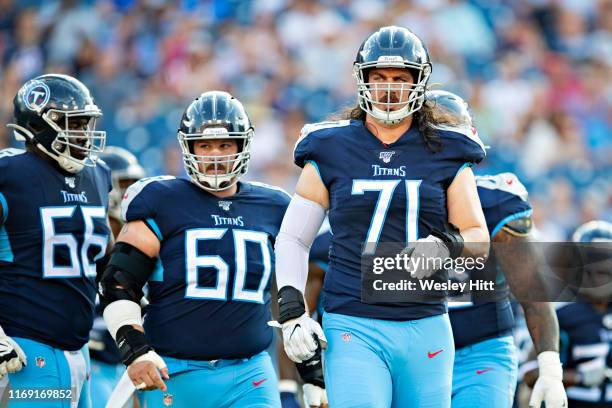 Dennis Kelly of the Tennessee Titans on the field during a game against the New England Patriots during week two of the preseason at Nissan Stadium...