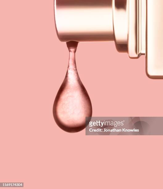 foundation dripping out of bottle - cosmetic products stock pictures, royalty-free photos & images