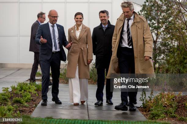 Crown Princess Victoria of Sweden and Crown Prince Frederik of Denmark visit the top of the power plant Amager Bakke on September 18, 2019 in...