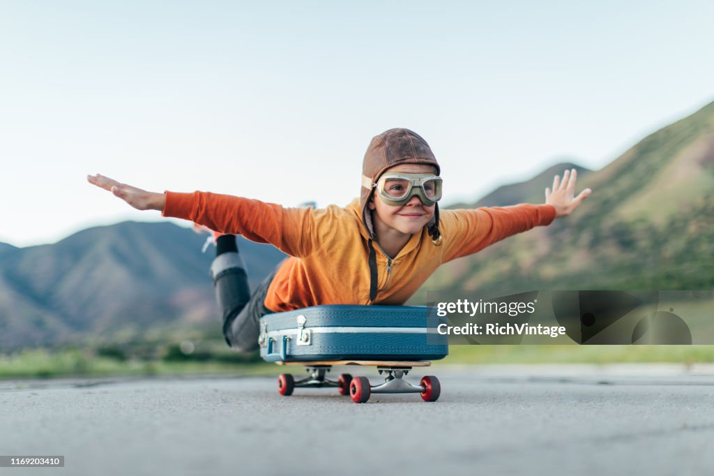 Young Boy Ready to Travel with Suitcase