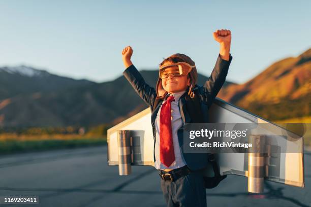 young boy businessman flying with jet pack on skateboard - challenge launch stock pictures, royalty-free photos & images