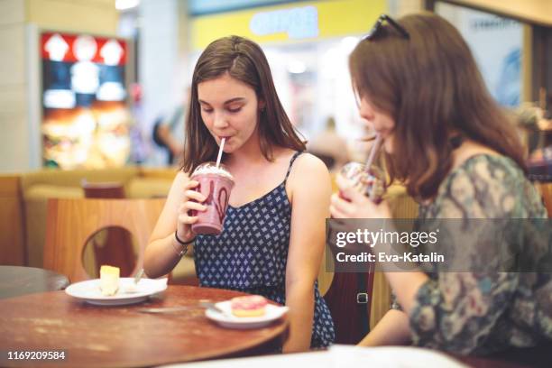 best friends - milkshake stock pictures, royalty-free photos & images