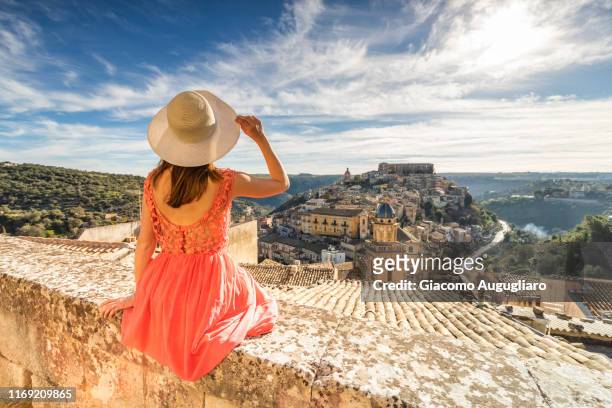 woman admiring the church of santa maria dell'itria and ragusa ibla in the background, ragusa, sicily, italy, europe - ragusa sicily stock pictures, royalty-free photos & images