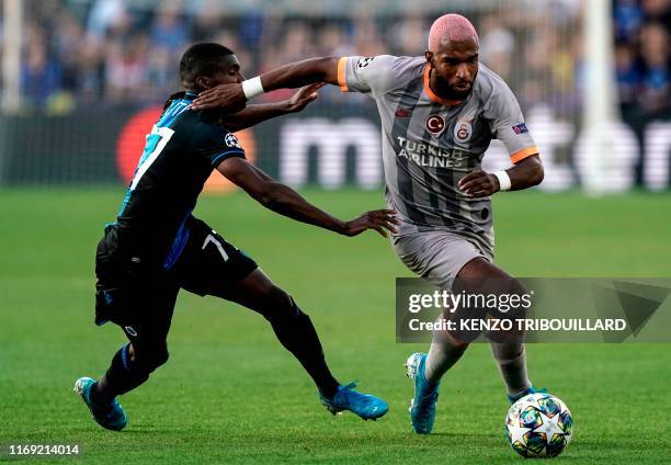 Club Brugge's Angolan defender Clinton Mata vies with Galatasaray's Dutch forward Ryan Babel during the UEFA Champions League Group A football match...