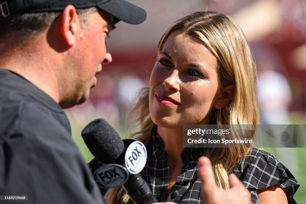 FOX Sports broadcaster Jenny Taft interviewing Ohio State head coach FOX Sports broadcaster Jenny Taft interviewing Ohio State head coach