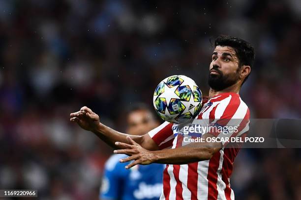 Atletico Madrid's Spanish forward Diego Costa controls the ball during the UEFA Champions League Group D football match between Atletico Madrid and...