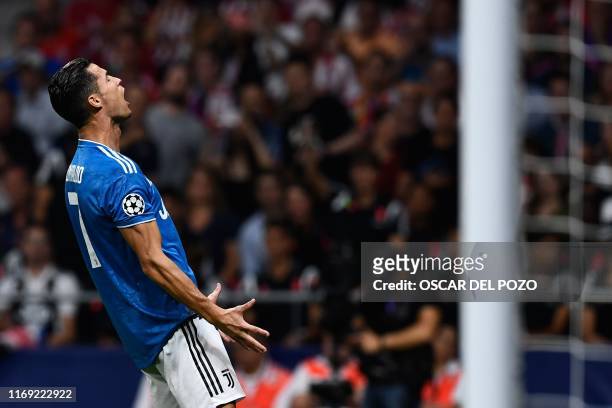 Juventus' Portuguese forward Cristiano Ronaldo reacts during the UEFA Champions League Group D football match between Atletico Madrid and Juventus,...