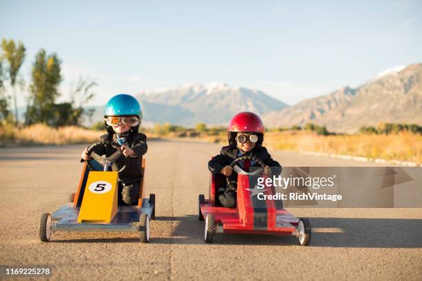 young business boys racing toy cars - challenge stock pictures, royalty-free photos & images