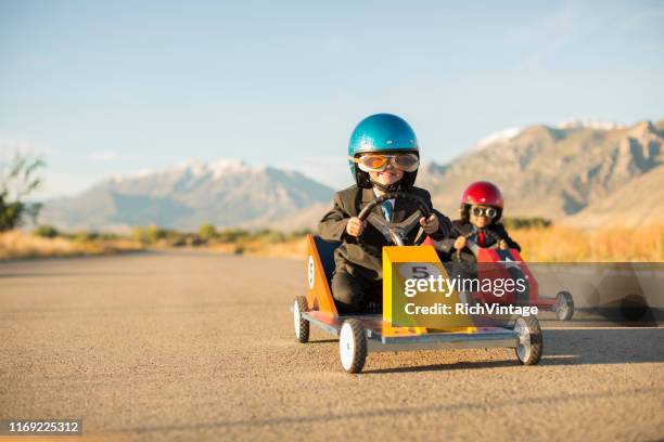 young business boys racing toy cars - driving humor stock pictures, royalty-free photos & images