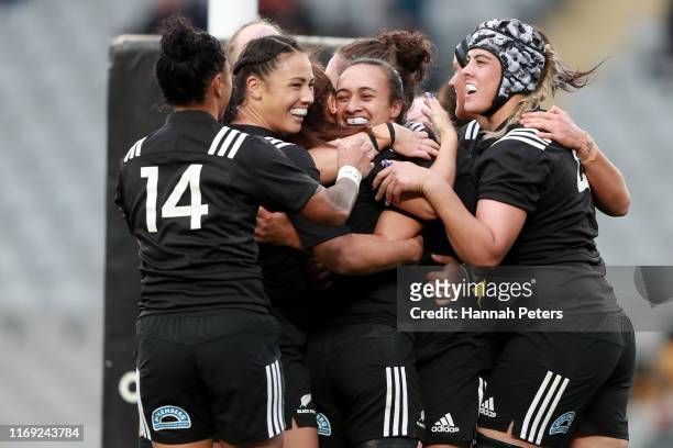 Ruahei Demant of the Black Ferns celebrates with her team after scoring a try during the Women's Test Match between the New Zealand Black Ferns and...