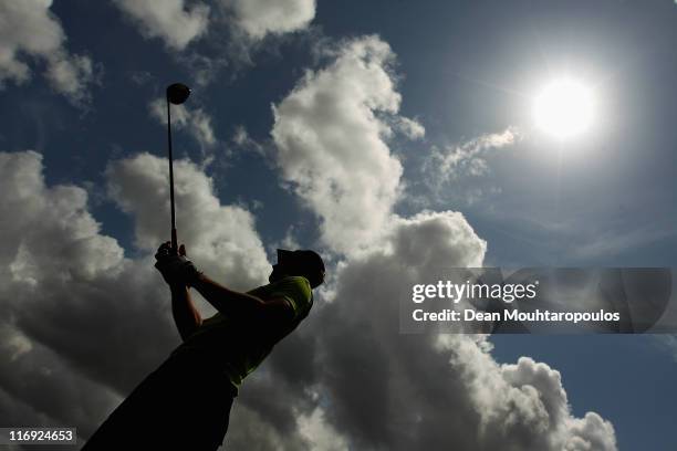 Jamie Elson of England hits practice balls on the driving range after his round on day three of the Saint Omer Open on June 18, 2011 in St. Omer,...