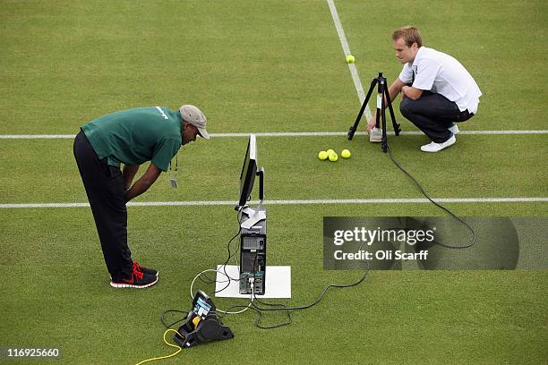 Hawk-Eye technicians check their ball detection systems on Courts No.3 at the All England Lawn Tennis and Croquet Club ahead of the Wimbledon Lawn...