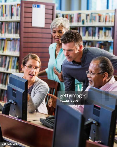 Librarian Using Computer Librarian Computer Photos and Premium High Res Pictures - Getty Images