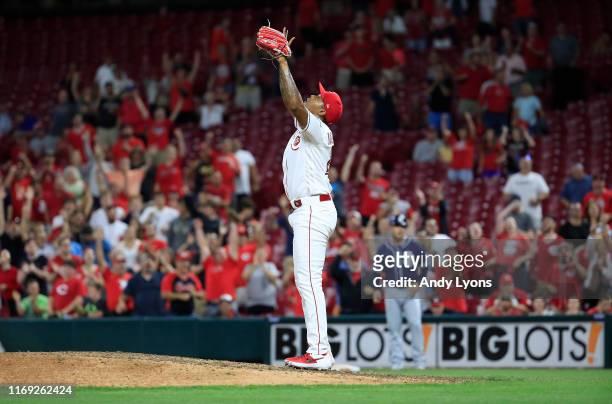 Raisel Iglesias of the Cincinnati Reds celebrates after the final out of the 3-2 win against the San Diego Padres at Great American Ball Park on...
