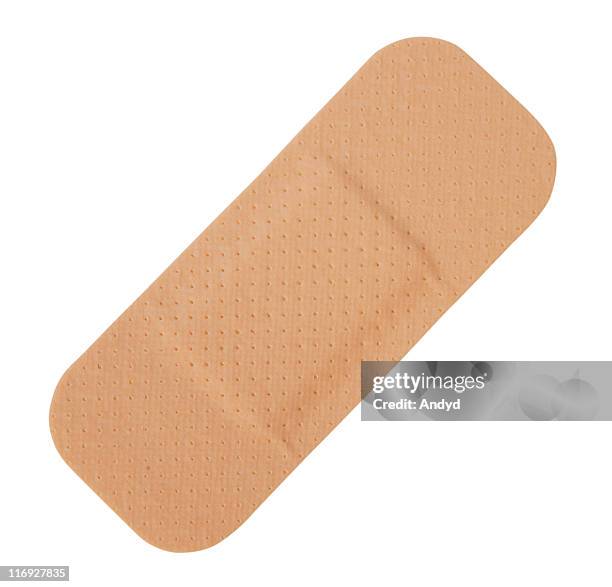 single tan-colored band-aid on a white background - plåster bildbanksfoton och bilder