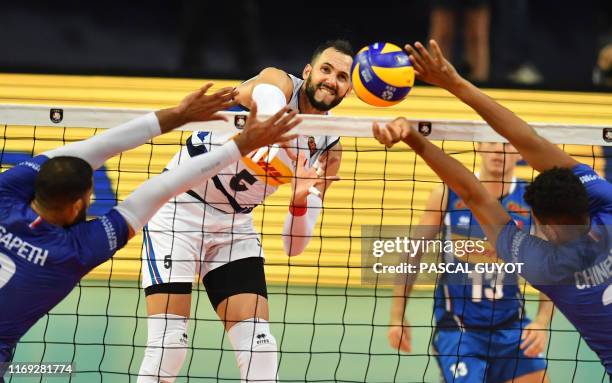 Italy's Osmany Juantorena plays a shot in front of France's Earvin Ngapeth and France's Barthelemy Chinenyeze during the Euro 2019 volleyball match...