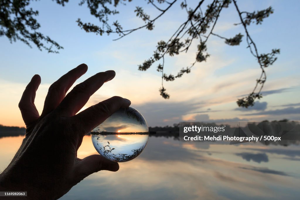 Hand holding crystal ball