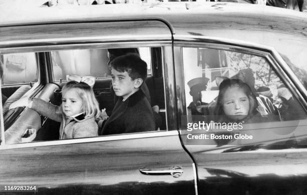 Kara Kennedy, daughter of Ted Kennedy, left, Robert F. Kennedy Jr., center and Courtney Kennedy, daughter of Robert F. Kennedy, ride in a car in...