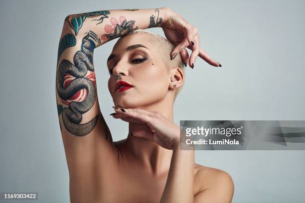hold your head up high darling - body piercings stock pictures, royalty-free photos & images