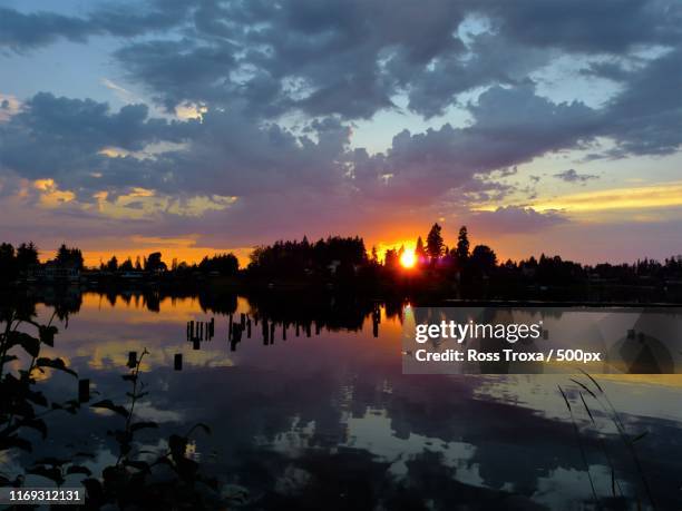 colorful sunset on surprise lake - edgewood stock pictures, royalty-free photos & images