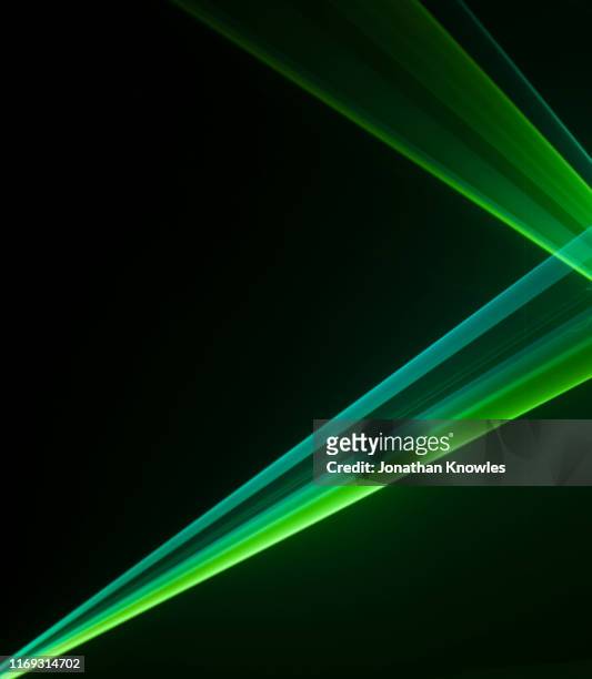two green laser strips of light - sunbeam ストックフォトと画像